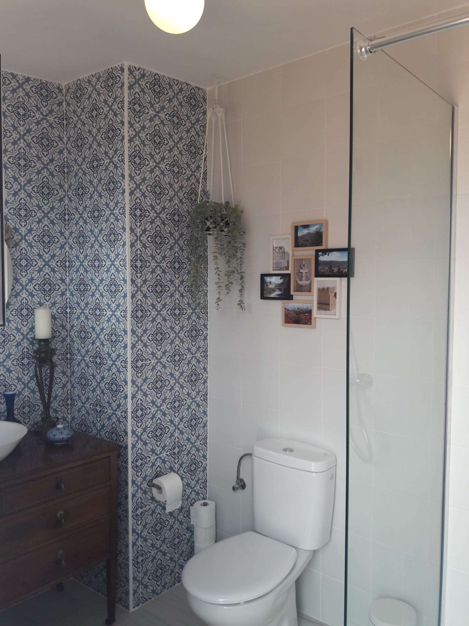 Shower room with blue patterned tiles