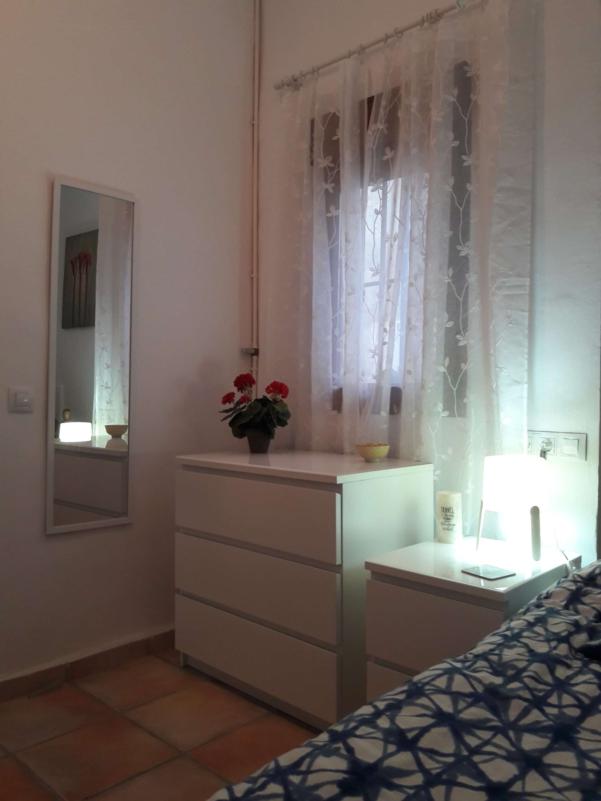 Single bedroom with white drawer units